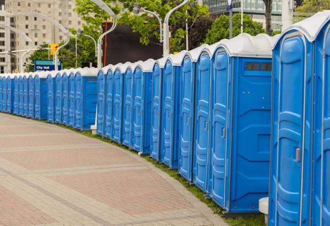 a row of portable restrooms at a fairground, offering visitors a clean and hassle-free experience in francestown