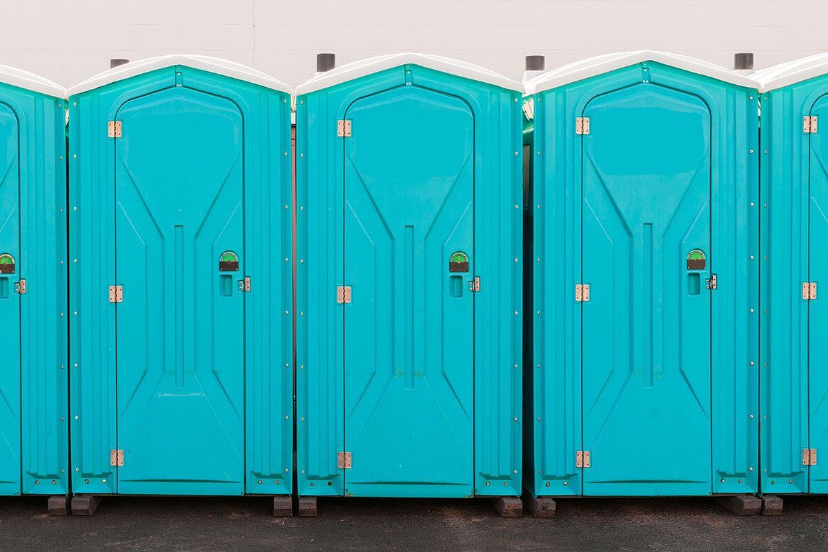 Industrial portable restroom units at a plant in Nashua, New Hampshire